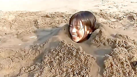 Girl Buried In Beach